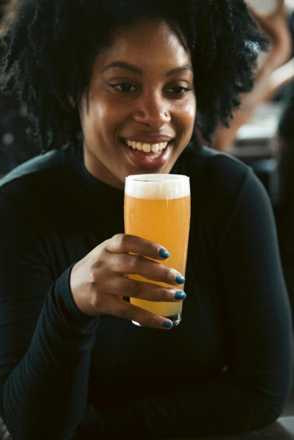 Woman Holding Beer Mug